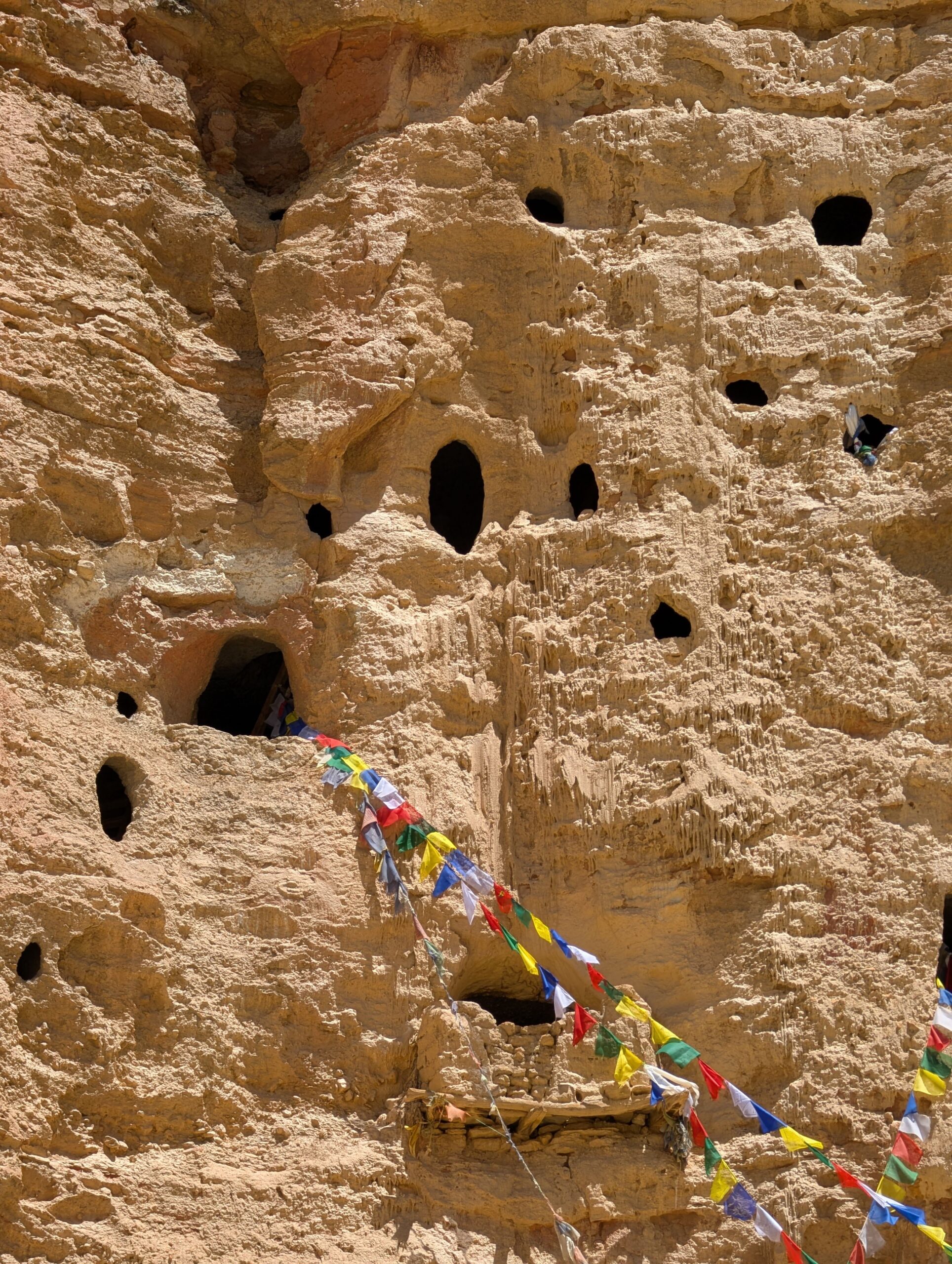 Ancient cave dwellings carved into the cliffs near Lo Manthang
