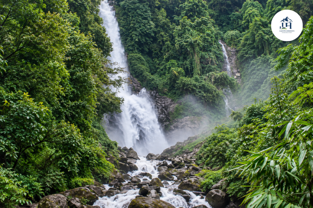 lauke waterfall near kakani and nuwakot surrounded by dense green forest during the rainy season