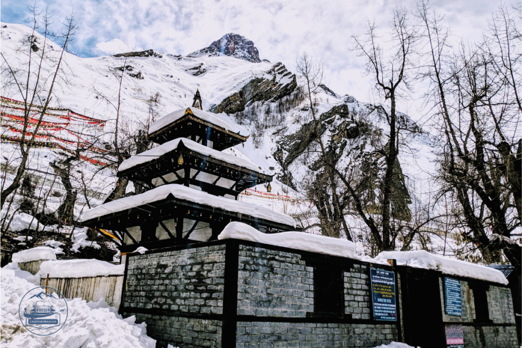 Muktinath Temple surrounded by snow-covered mountains during winter in Mustang, Nepal.
