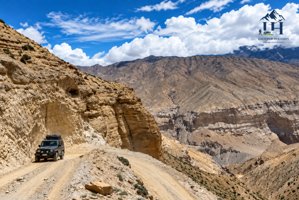 jeep travelling on a rough mountain road through upper mustang
